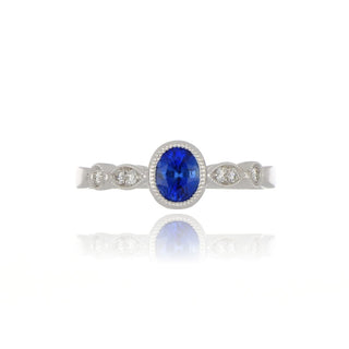 18ct White Gold Oval Cut Sapphire Ring With Fancy Set Diamond Shoulders